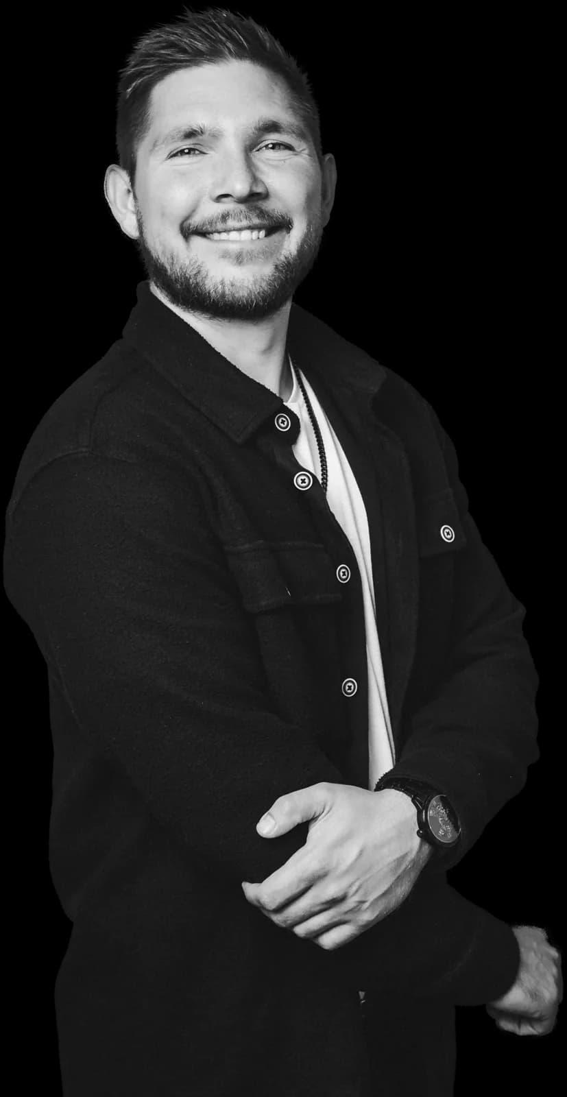 Portrait of Bjørn Nyborg smiling, wearing a black overshirt